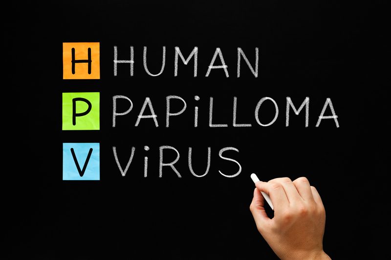 A person writing on the board human papilloma virus
