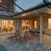 A patio with chairs and tables in it